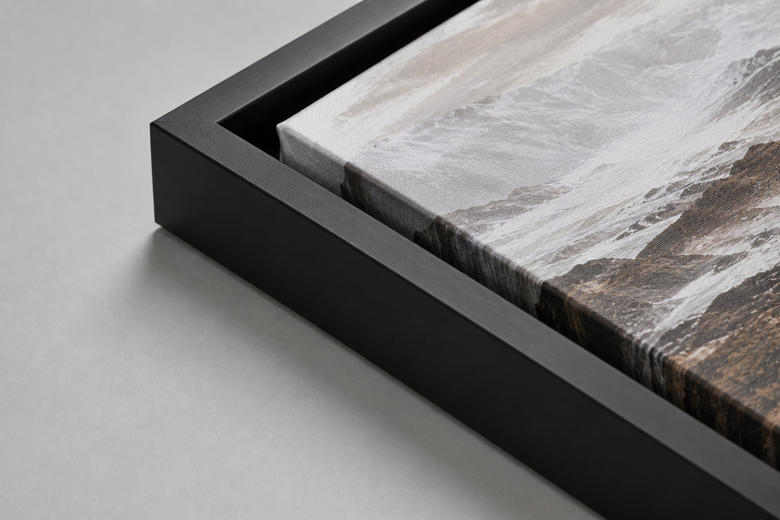 Black floater frame corner with canvas set inside