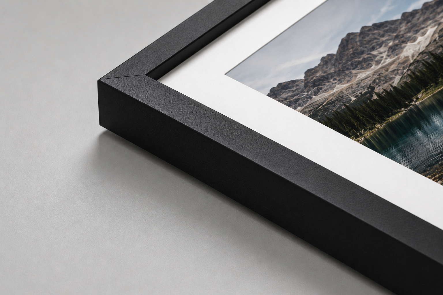 Matte black frame corner with white mat and print